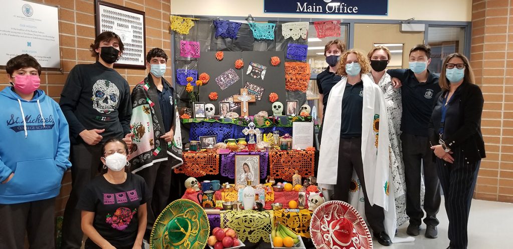 SMCS students and the Spanish Club in front of the altar they built to mark Día de Muertos (Day of the Dead).