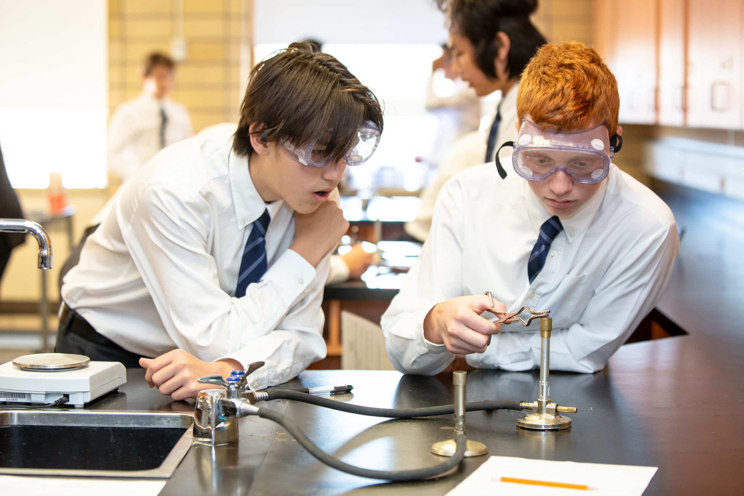 SMCS Programmes - academic programme,, boys doing science experiment